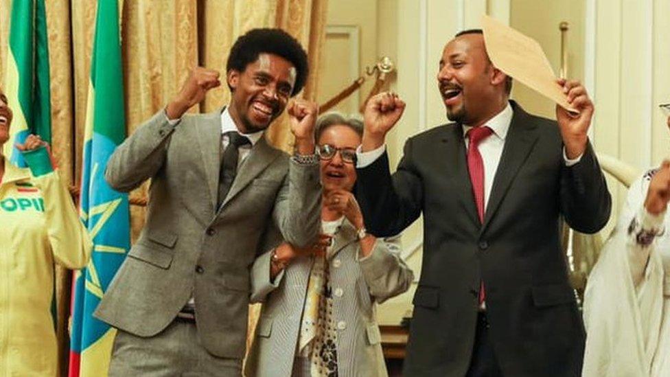 Feyisa (l) President Sahle-Work Zewde (c) and Prime Minister Abiy Ahmed (r)