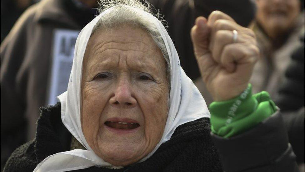 Argentine co-founder of the "Madres de Plaza de Mayo" human rights association Nora Cortinas, wears a white -symbol of the organization- and a green -symbol of activists in favour of the legalization of abortion- headscarf, during their weekly march at Plaza de Mayo square in Buenos Aires on July 05, 2018.