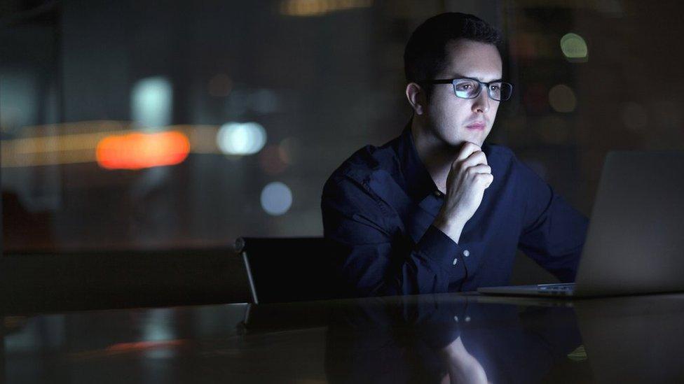 Businessman looking at laptop