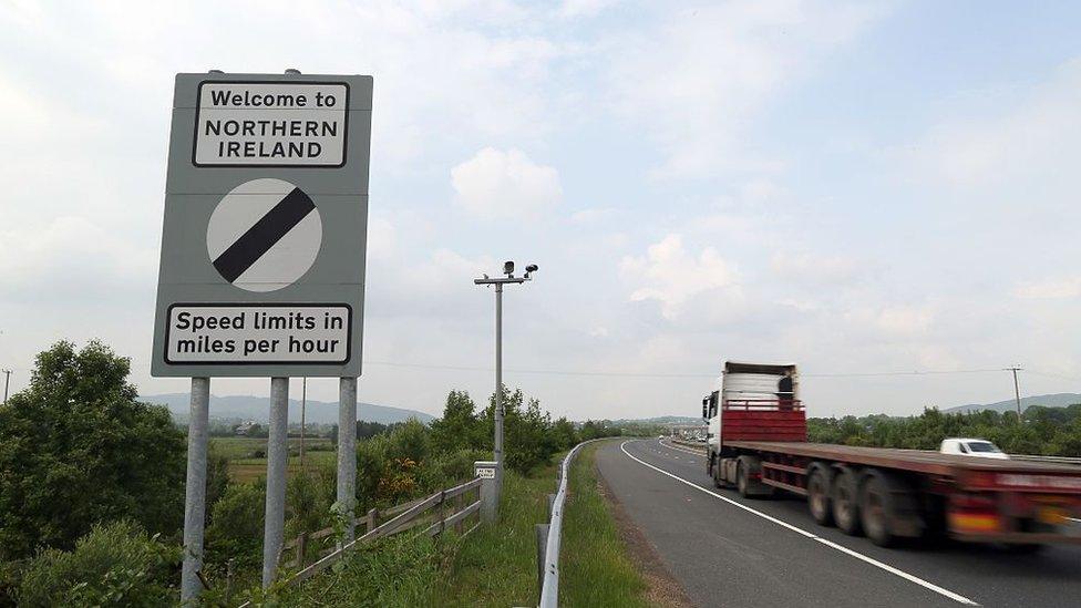 Traffic passes a border sign at Newry as you enter Northern Ireland from the south