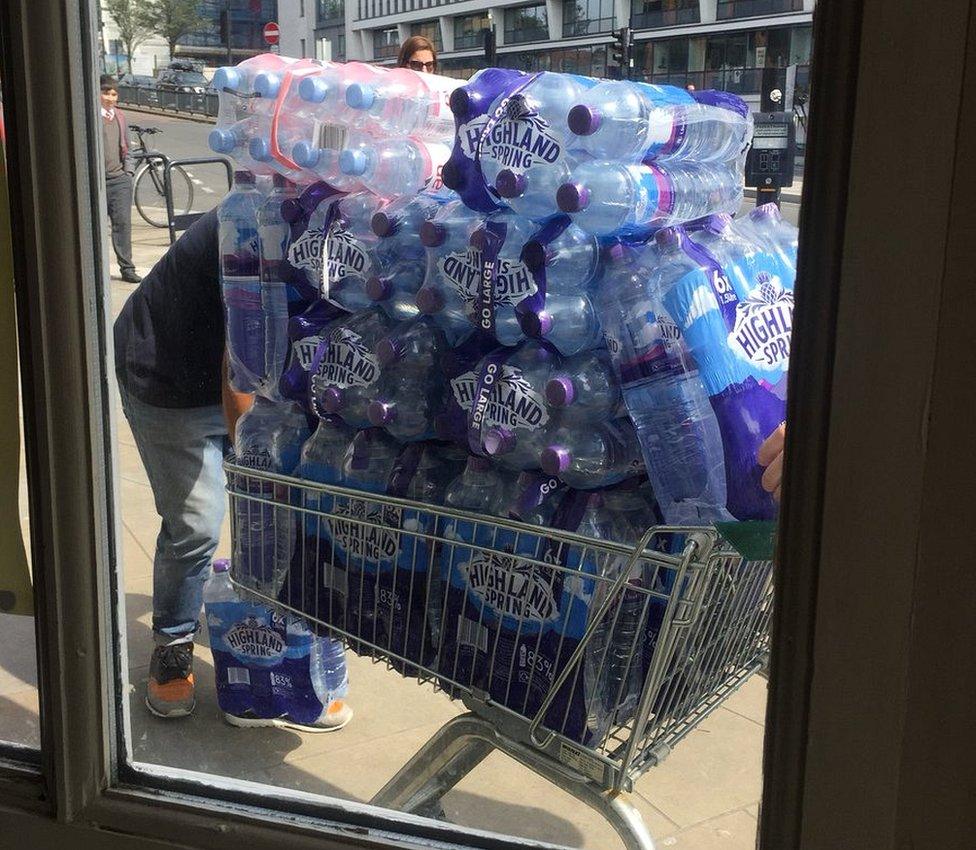 Person buying water in Twickenham