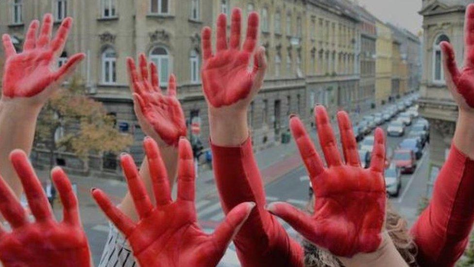 Hands painted in red