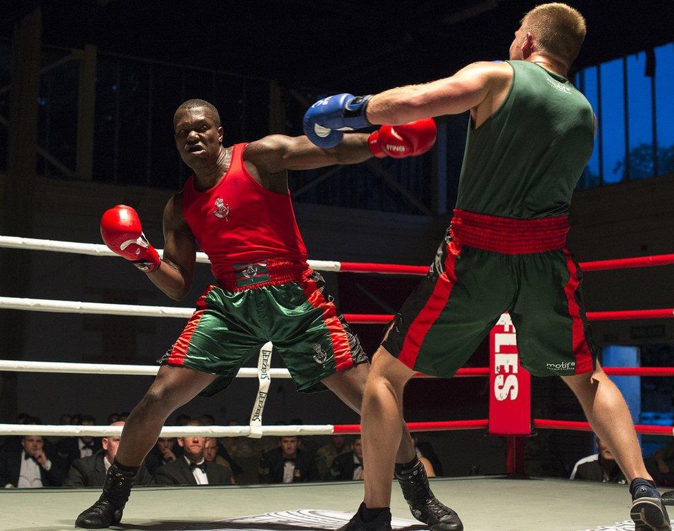 Two boxers in a boxing ring