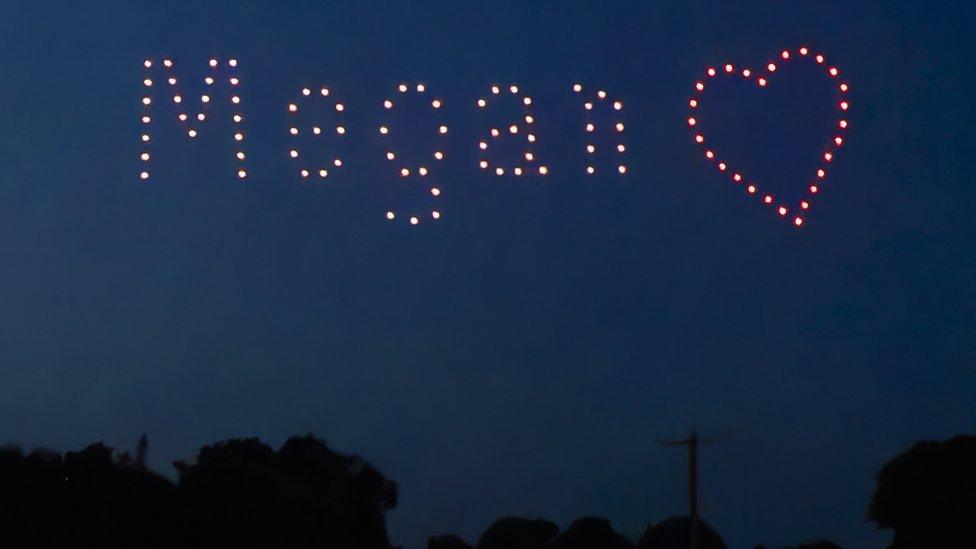 Drones spell out Megan's name and form a love heart