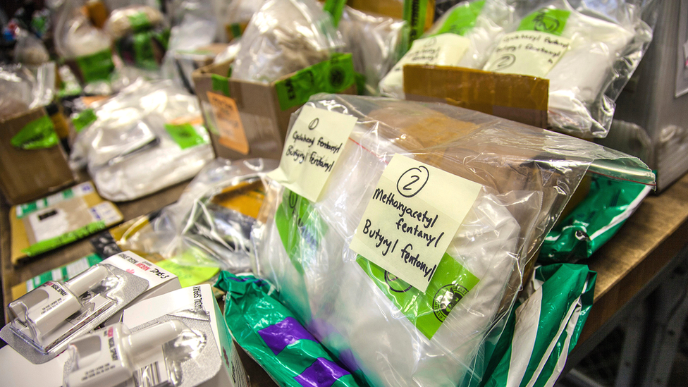 US Customs and Border Protection officers locate fentanyl and other narcotics hidden in a package at the International Mail Facility November 28, 2017 in Chicago, Illinois.