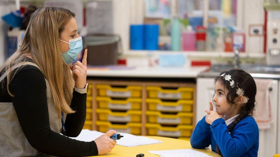 girl-and-teacher-in-classroom