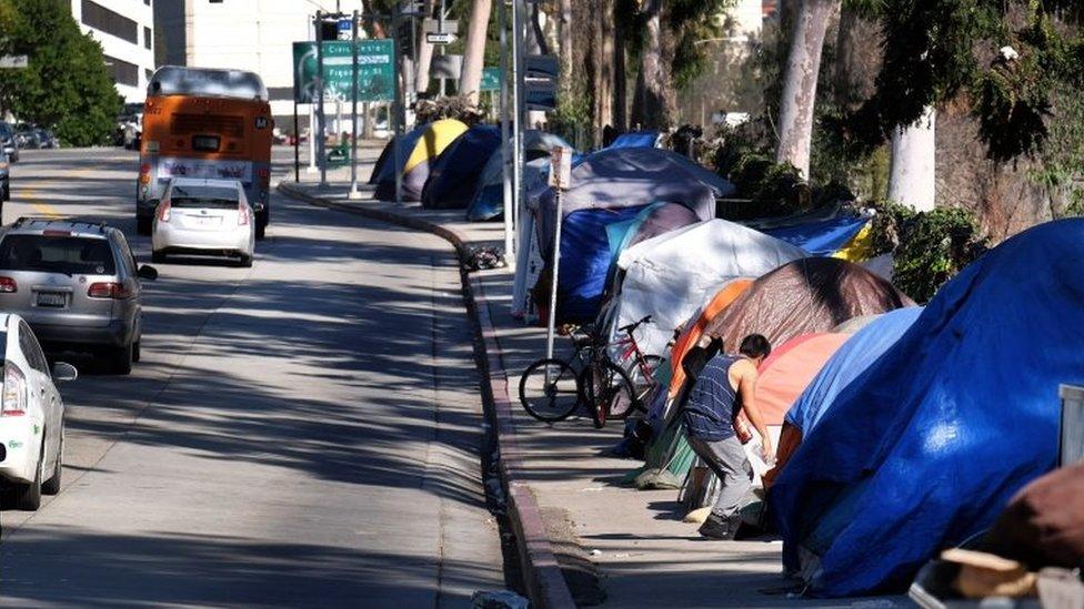 Tents from a homeless encampment line a street in downtown Los Angeles on 26 January 2016