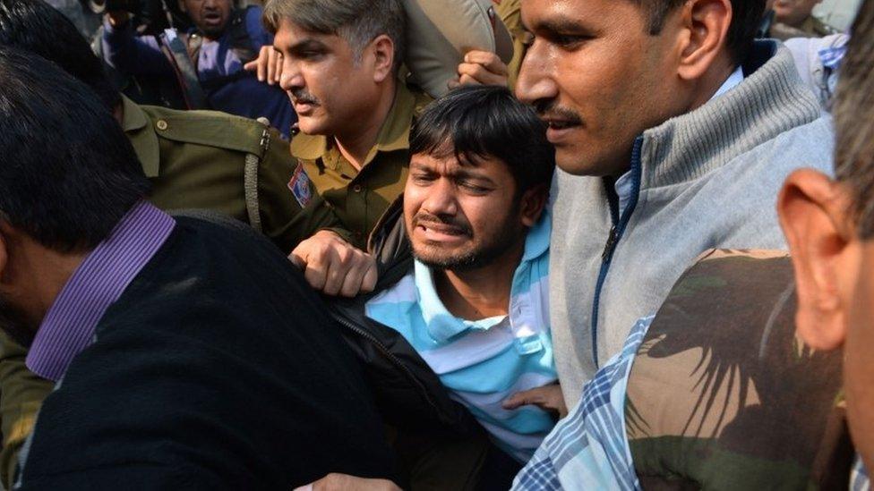 A file picture taken on February 17, 2016 shows Indian student union leader Kanhaiya Kumar (C) being escorted by police into Patiala Court for a hearing in New Delhi on February 17, 2016.