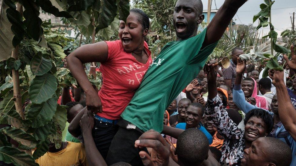 Opposition supporters celebrate the Supreme Court's decision