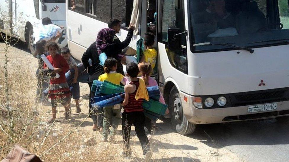 Syrian families evacuated from Aleppo by the Syrian army in Aleppo