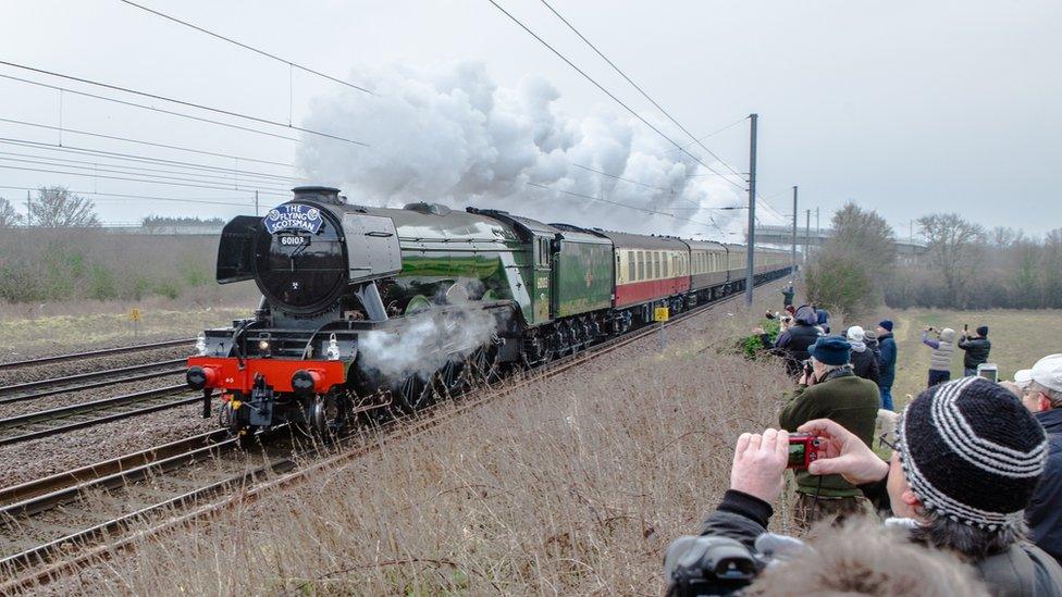 Spectators taking photos of Flying Scotsman