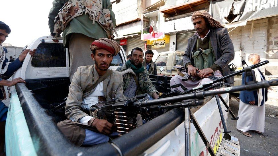 Houthi fighters sit in a vehicle in Sanaa, Yemen (4 December 2017)