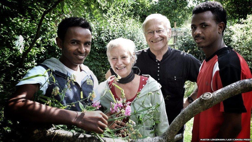 Martin Patzelt and wife flanked by the two Eritrean refugees