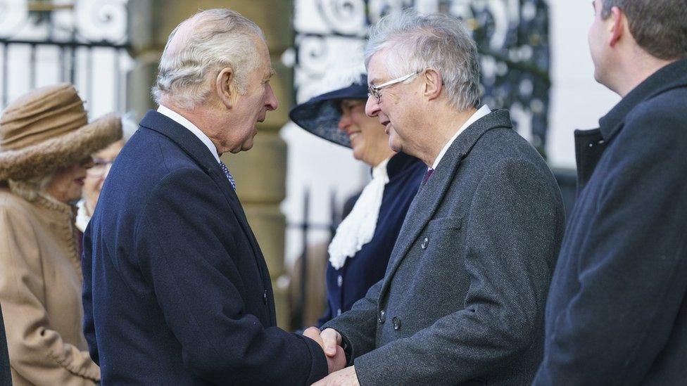 King Charles III (left) meets First Minister of Wales Mark Drakeford as he arrives to attend a celebration at St Giles' Church to mark Wrexham becoming a City. Picture date: Friday December 9, 2022. PA Photo. See PA story ROYAL King. Photo credit should read: Dominic Lipinski/PA Wire