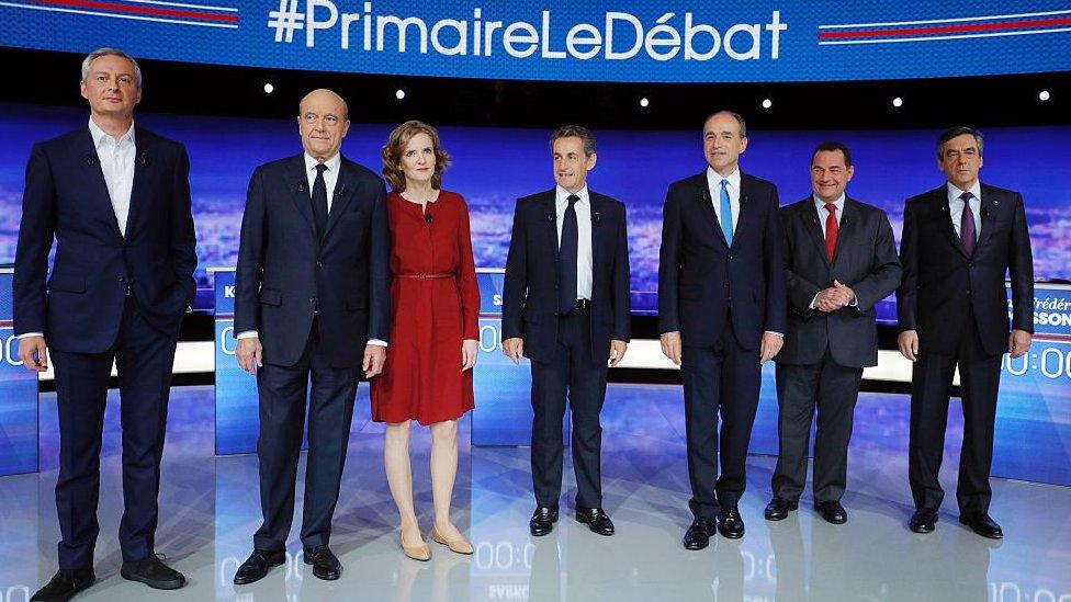 Candidates for the right-wing Les Republicains (LR) party primaries ahead of the 2017 presidential election: L to R Bruno Le Maire, Alain Juppe, Nathalie Kosciusko-Morizet, Nicolas Sarkozy, Jean-Francois Cope, Jean-Frederic Poisson and Francois Fillon pose before the first televised debate between the seven candidates for France's right-wing presidential nomination, on 13 October 2016 at the studios of French private television channel TF1 in La Plaine-Saint-Denis, north of Paris