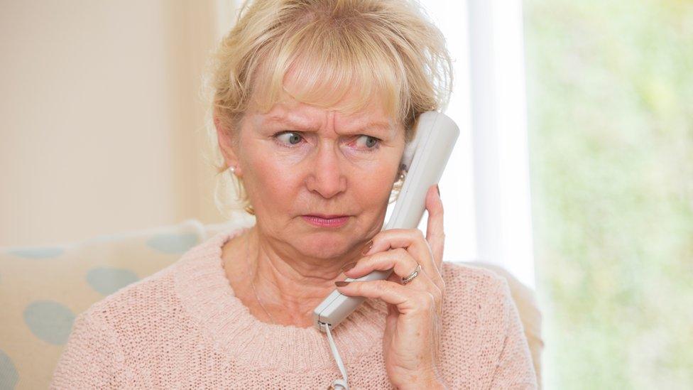 Worried woman on phone