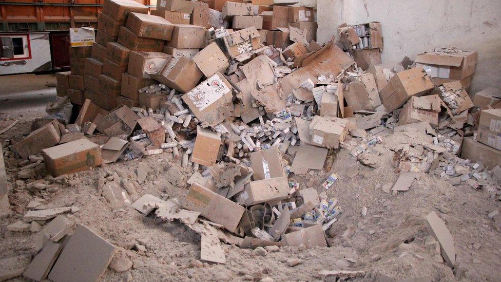 Damaged Red Cross and Arab Red Crescent medical supplies are seen in a warehouse in the town of Urum al-Kubra on the western outskirts of the northern Syrian city of Aleppo on September 20, 2016, the morning after a convoy delivering aid was hit by a deadly air strike