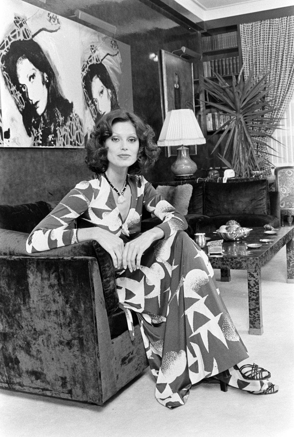 A model wears one of DVF's seagull print wrap dresses in 1975