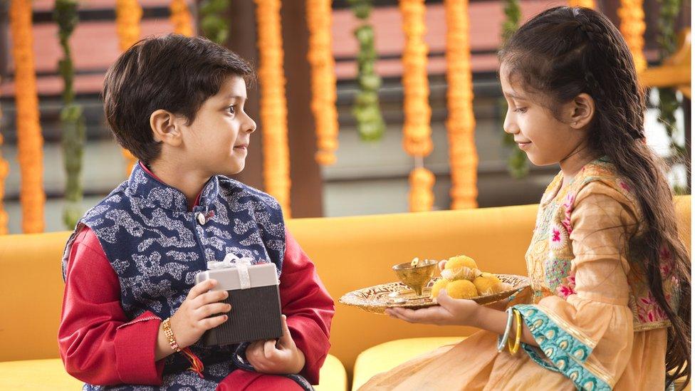 boy giving gift to girl