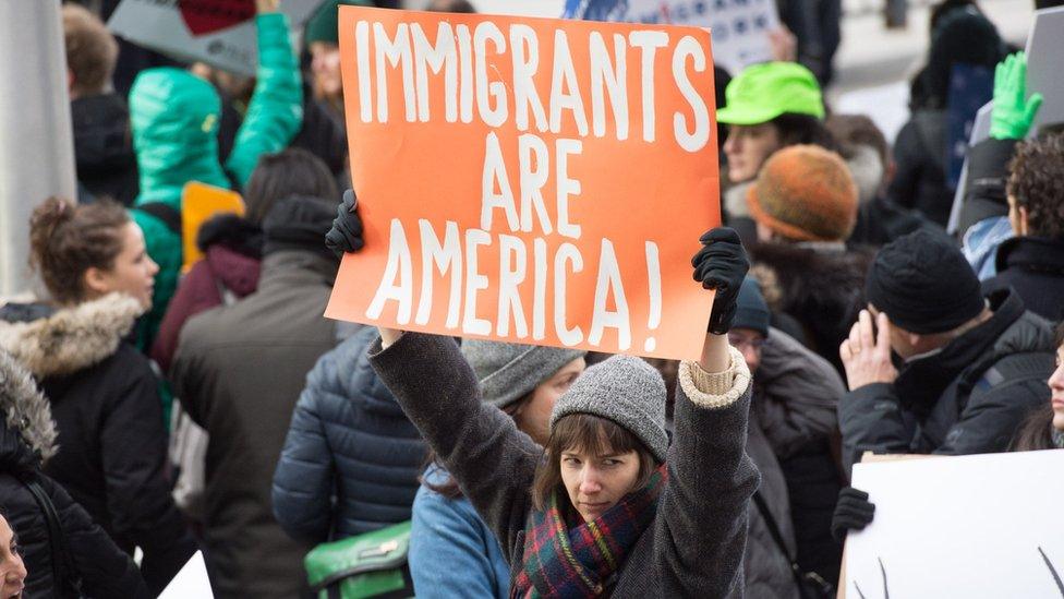 Protesters gather at JFK International Airport's Terminal 4 to demonstrate against President Donald Trump's executive order on January 28, 2017, in New York