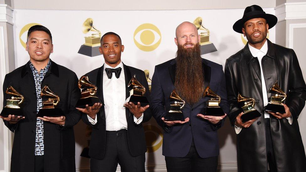 The Stereotypes holding their Grammy trophies