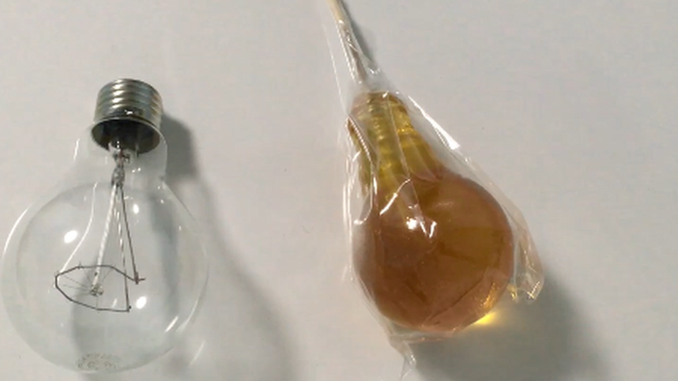 A light bulb and a light bulb-shaped sweet