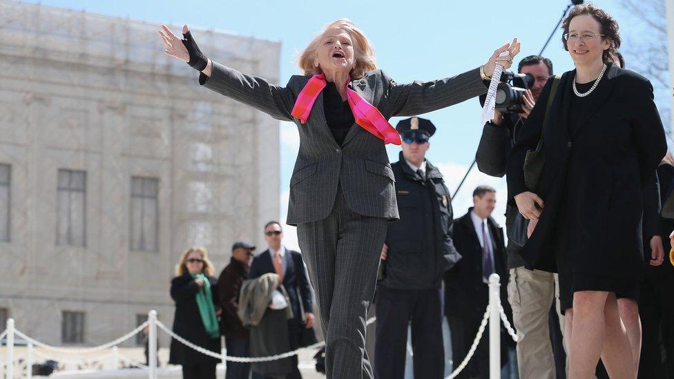 Edith Windsor, 83, acknowledges her supporters as she leaves the Supreme Court March 27, 2013 in Washington, DC.