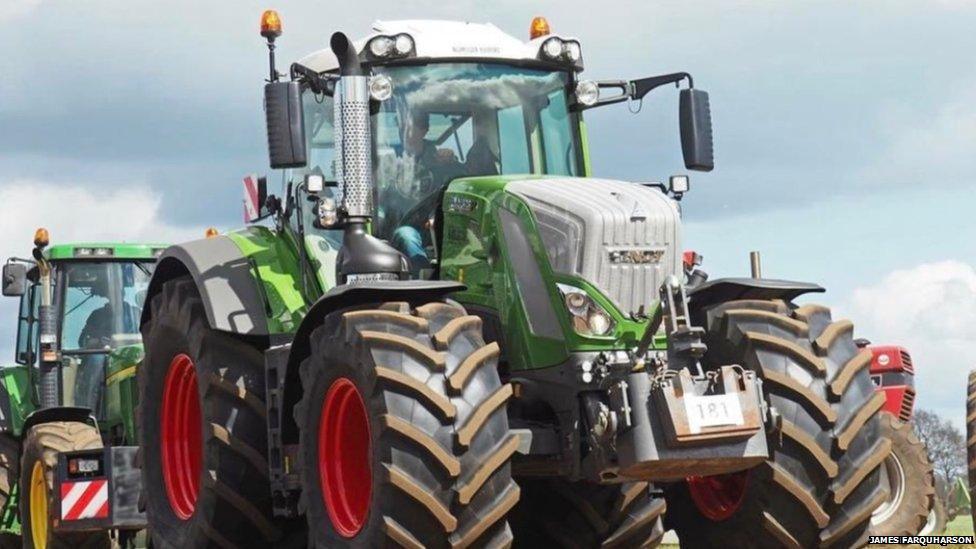 A tractor with oversized wheels