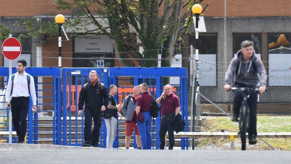 Workers at the factory gate