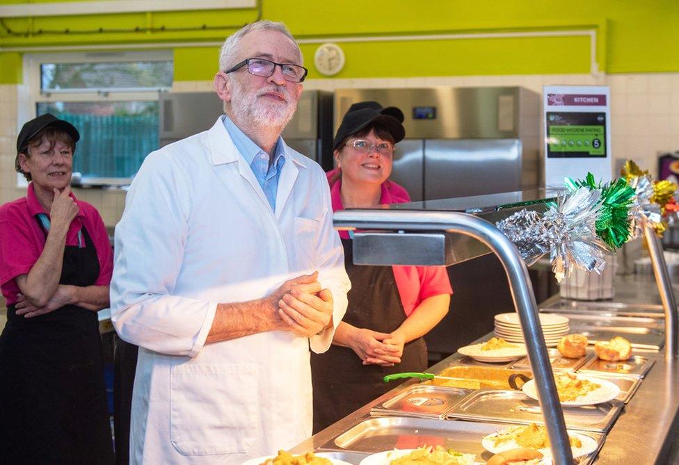 Labour's Jeremy Corbyn joins canteen staff to help serve school dinners to staff and students at Bilton High School in Rugby, while on the General Election campaign trail.