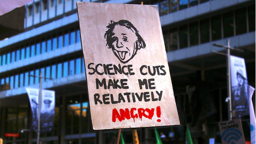 Protesters hold placards and banners as they participate in the March for Science rally on Earth Day, in Sydney, Australia, 22 April 2017