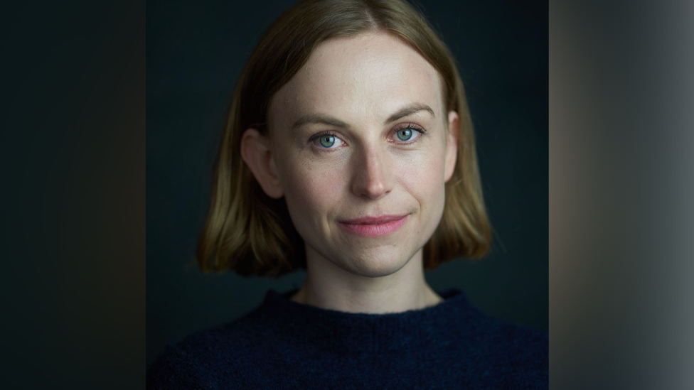 Beth Park is wearing a dark top in the head and shoulders photo, looking directly at the camera with a subtle smile