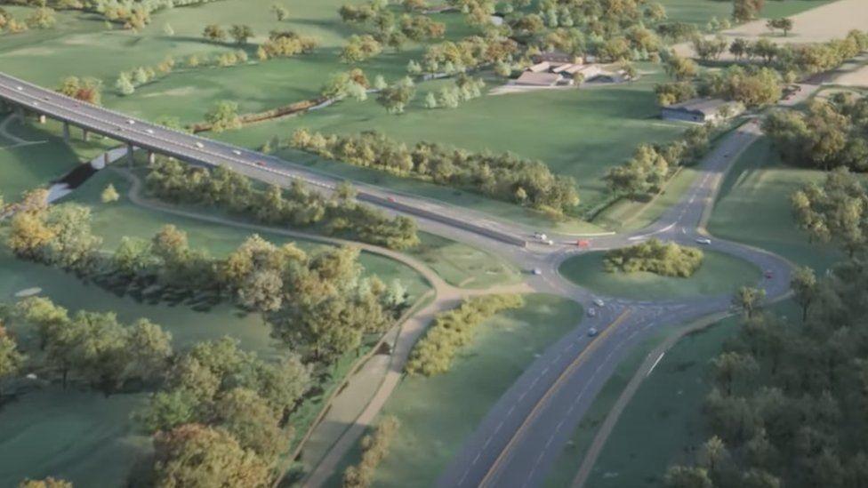 An artist's impression of part of the Norwjch Western Link Road showing a bridge carrying a dual carriageway through the Wensum Valley. The road - shown from the air - is surrounded by fields and trees