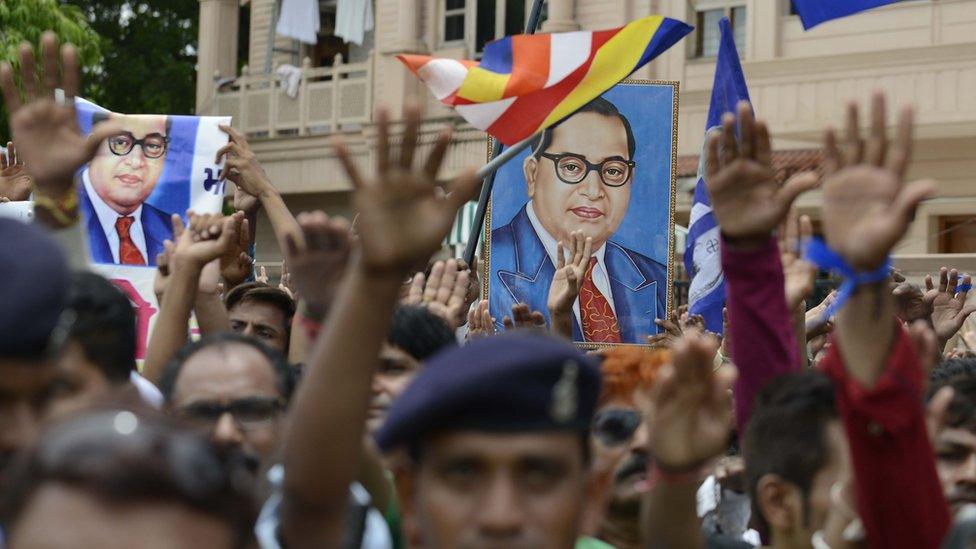 Photographs of Dr Ambedkar are raised as Dalits protest against the flogging of four men in Gujarat town on July 31, 2016