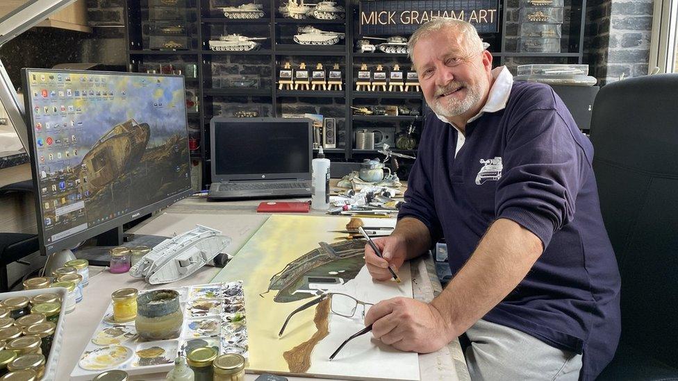 Mick Graham at his desk