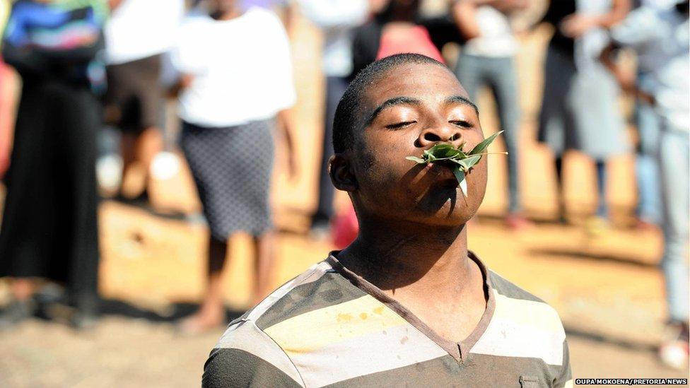 A man eats grass at service
