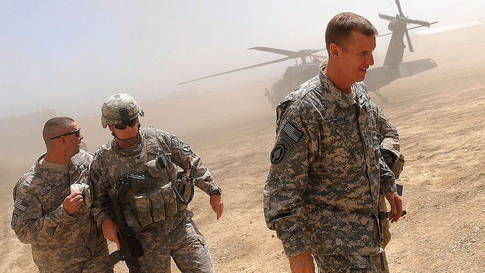 Commander of the NATO-led International Security Assistance Force (ISAF) US General Stanley McChrystal (R) arrives at the Baraki Barak Joint combat Outpost (JCOP) in Logar Province on 21 August 2009