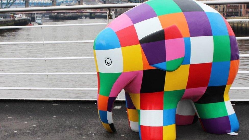 An Elmer sculpture with the Tyne Bridge in the background