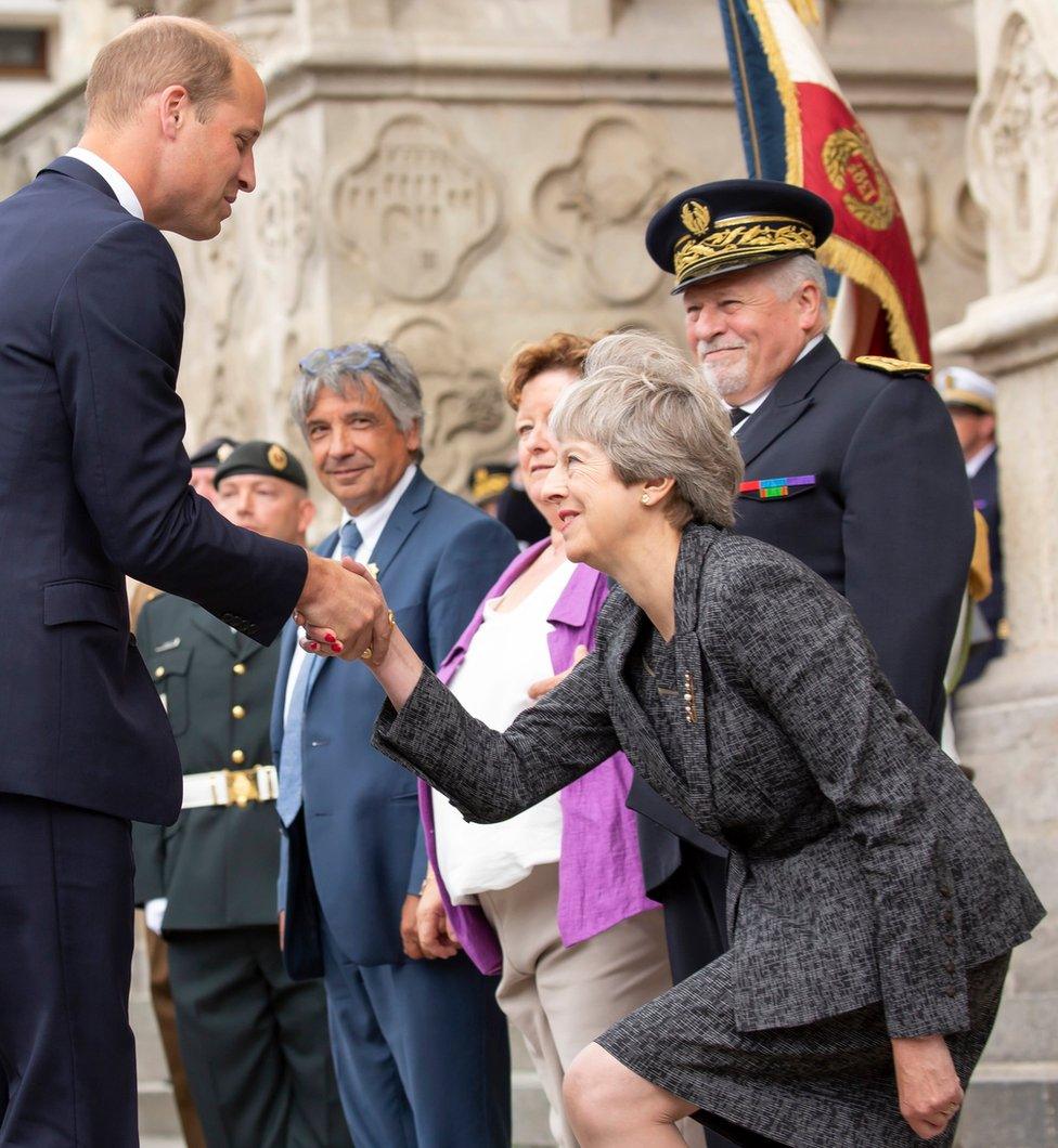 Prince William greets Theresa May as they arrive at the commemoration marking the 100th anniversary of the Battle of Amiens, held at the Amiens Catheral, in Amiens, northern France