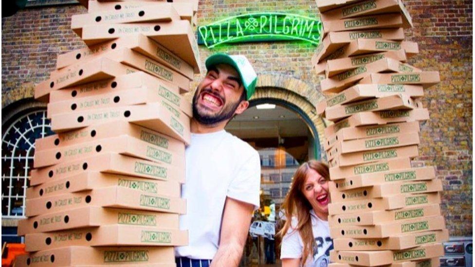 Pizza Pilgrims staff carrying boxes