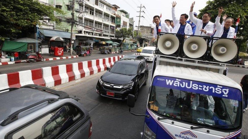 Leaders of the pro-junta political party Palang Pracha Rath travel through the streets on a vehicle to thank people who came out to vote for them