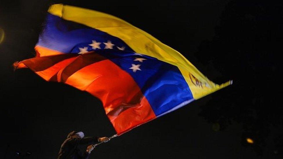 Venezuelan opposition supporters celebrate the results of the legislative election in Caracas, on the early morning December 7, 2015