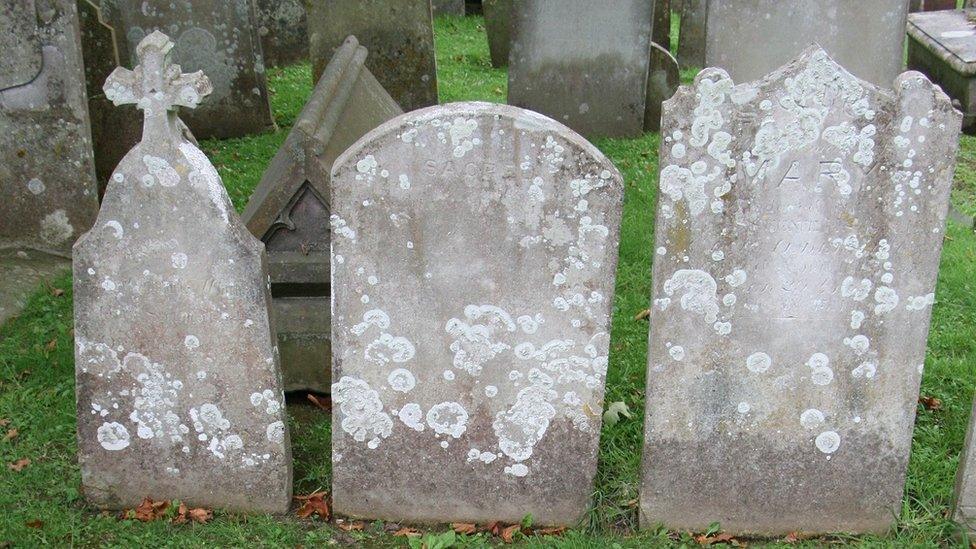 Three graves lined next to each other