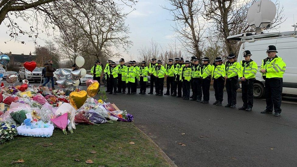 Police lay flowers