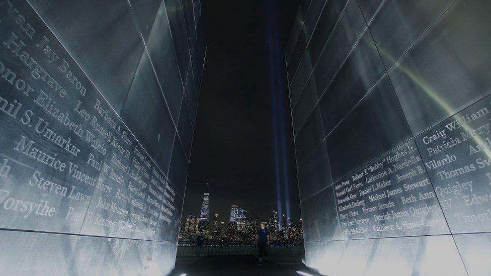 The annual Tribute in Light marking the 17th anniversary of the attack on the World Trade Center is illuminated in lower Manhattan next to One World Trade Center in New York City on September 11, 2018 as seen from the Empty Sky 9/11 Memorial in Jersey City, New Jersey.