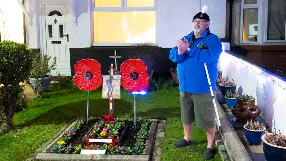 Melvyn Burlace paid tribute to Capt Sir Tom in his front garden in Cardiff