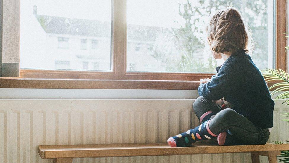 Child looking out of the window