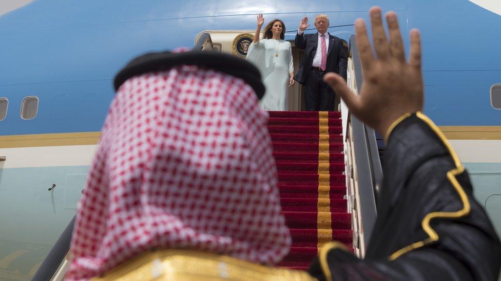 A handout picture provided by the Saudi Royal Palace on May 22, 2017, shows US President Donald Trump and First Lady Melania Trump waving as they board Air Force One before leaving Riyadh to Israel.