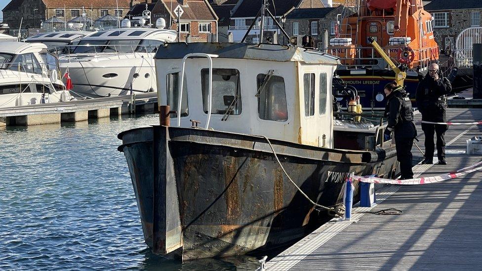 fishing boat with police presence