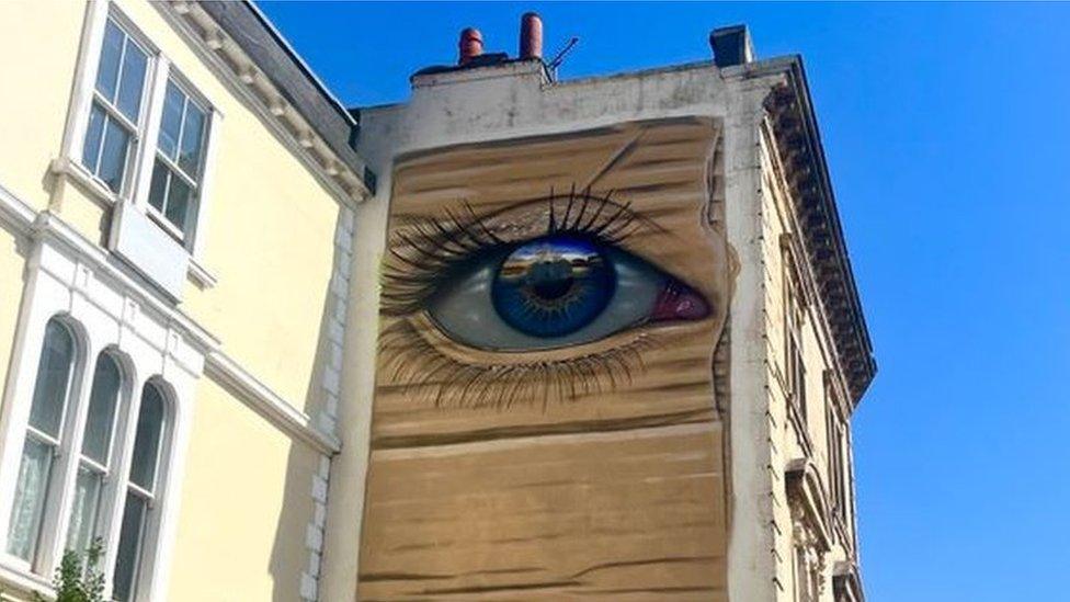 An eye mural on a building